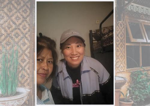 two women posing for a picture next to a cactus at Glory Homestay in Yogyakarta