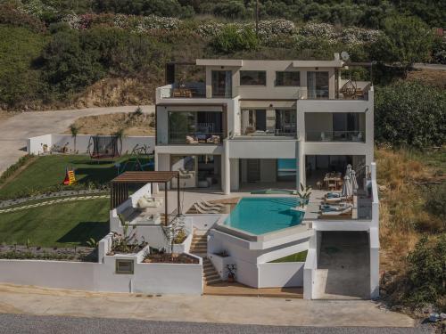 an aerial view of a house with a swimming pool at Luxurious Villa Selestine - With Private Pool in Panormos Rethymno