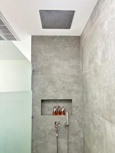 two people standing on a shelf in a bathroom at KPG Suite Dream in Ban Nua