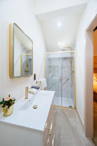 a bathroom with a sink and a shower at The Stables at The Talbot in Lytham St Annes