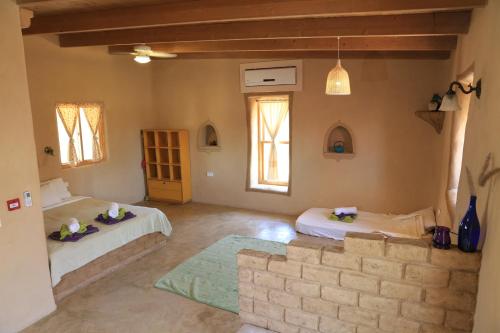 Llit o llits en una habitació de Rotem's-רותמ'ס