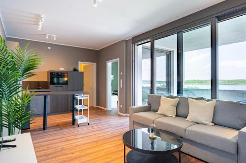 a living room with a couch and a table at Hafen 6 in Zwenkau