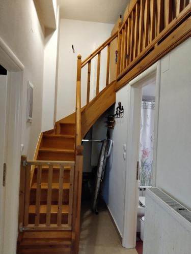 a staircase in a house with a bike leaning against the wall at Ktima Amigdalies in Neo Klima