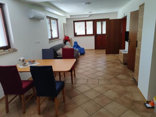 a living room with a table and a couch at Apartma Lara in Bled