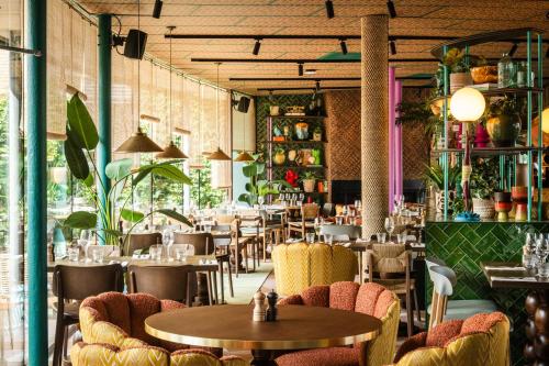 a restaurant with tables and chairs in a room at Quality Hotel The Reef in Frederikshavn