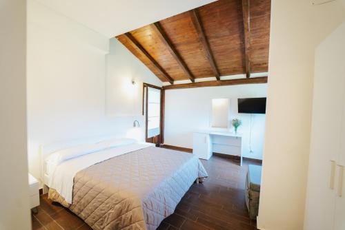 Postel nebo postele na pokoji v ubytování Relais Mediterraneo Collinebros