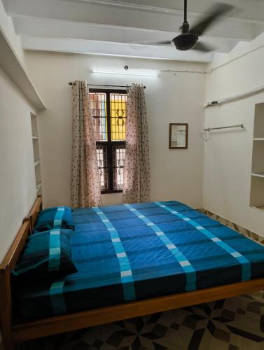 Cama o camas de una habitación en KHS Abhaya Mayavaram