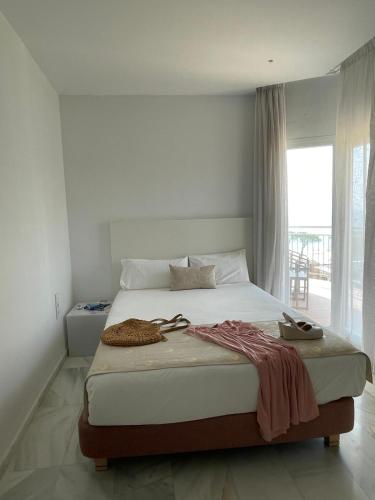 Hotel Aromarにあるベッド