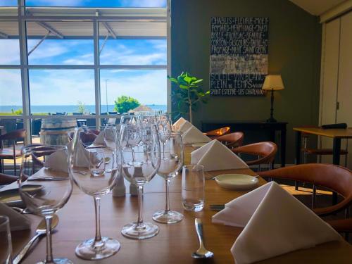 a table with wine glasses on top of it at Hotel Faaborg Fjord in Fåborg
