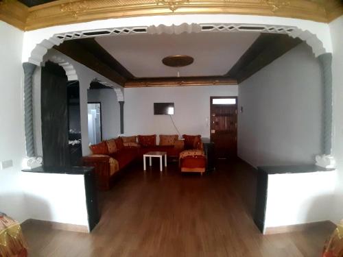 a living room with a couch and a table at Dar yahya in Chefchaouene