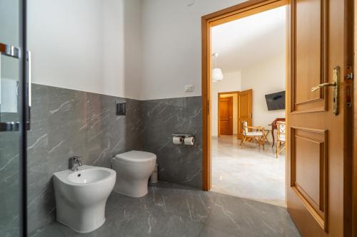 a bathroom with a toilet and a sink at Il Giardino di Venere in Mondello