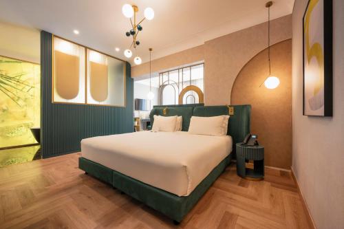 Postel nebo postele na pokoji v ubytování Je Rome Hotel