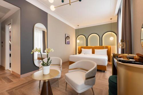 Postel nebo postele na pokoji v ubytování Je Rome Hotel
