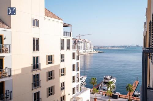 a view of the water from a building at Luxury Escapes - Breathtaking 1BR with Sea View Port Lamer in Dubai