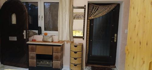 a room with a door and a counter and a window at VIP Coco Oasis Villa in Tozeur