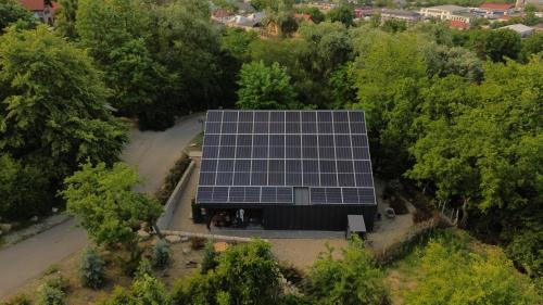 an overhead view of a house with solar panels on it at Chalet by Provence Suceava in Suceava