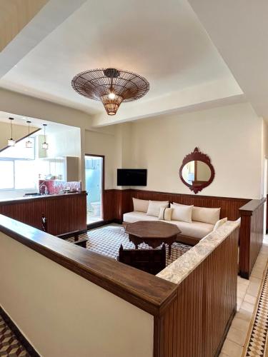 a living room with a couch and a table at Appartements Balima Résidences Sidem in Rabat