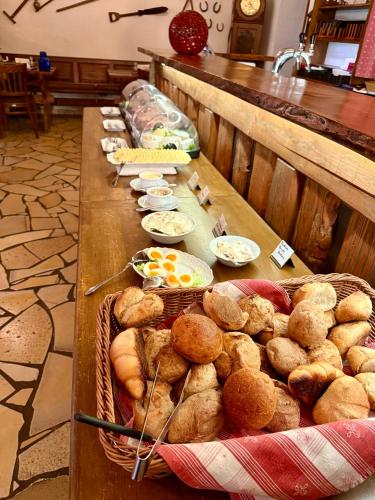 a buffet line of food on a table with pastries at Landhotel Gut Wildberg mit Sauna in Meißen
