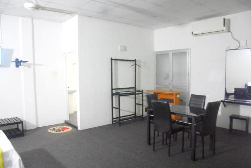 an empty room with a table and chairs in it at Hotel Romi Gampaha in Gampaha