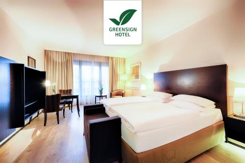 Ένα ή περισσότερα κρεβάτια σε δωμάτιο στο Welcome Parkhotel Euskirchen
