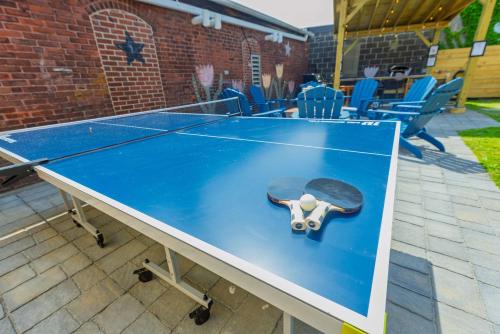 a ping pong table with a skateboard on it at Jennifer's Getaway Stunning Views & Private Deck in Providence