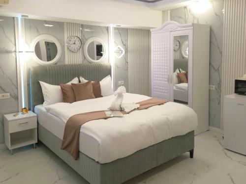 Ένα ή περισσότερα κρεβάτια σε δωμάτιο στο Iancu Jianu Premium Stay Studio 1