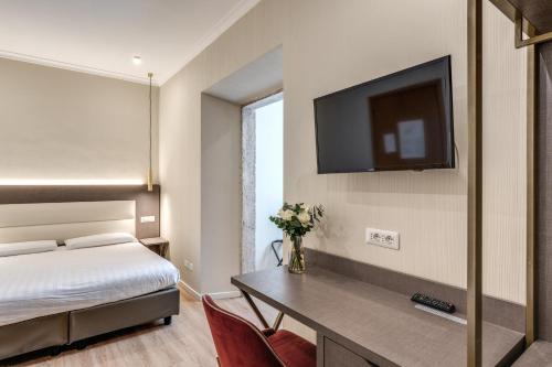 TV a/nebo společenská místnost v ubytování Flower Garden Hotel