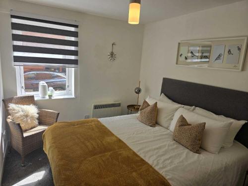 a bedroom with a large bed and a window at G1 Merchant City Glasgow in Glasgow