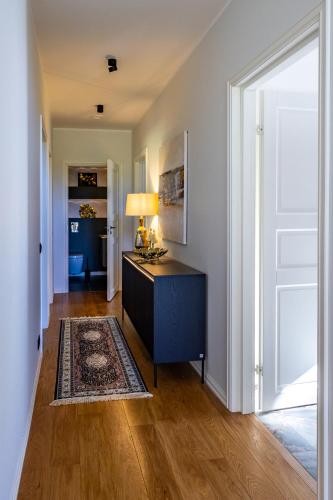 a living room with a dresser and a large window at Jasmin Holiday House Kassaris 