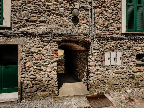 a stone building with a tunnel in the side of it at Outdoor Apt - Free Park - Bike Shuttle 3min in Finale Ligure