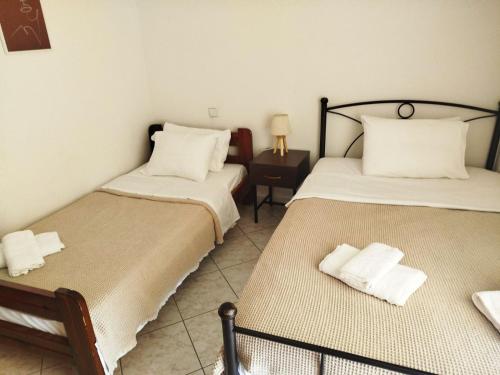 A bed or beds in a room at Small Apartment Trikala