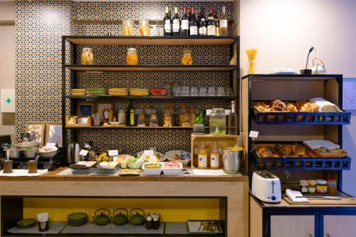 a kitchen with a counter with food on it at Radisson Serviced Apartments Antananarivo City Centre in Antananarivo