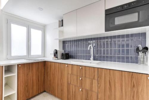 Photo de la galerie de l'établissement Chapelle Ordener Cosy Apartment Mezzanine 4P, à Paris