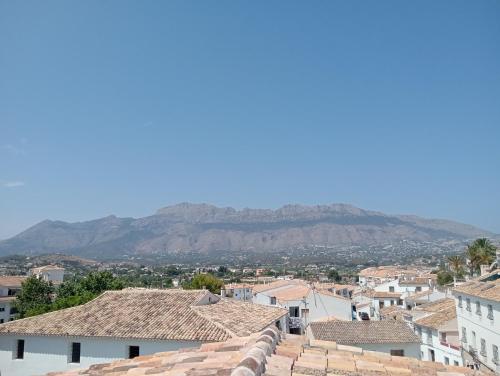a view of a city with mountains in the background at Nomad Hotel & Spa Altea in Altea