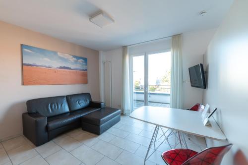 a living room with a couch and a table at first Apart in Erlangen