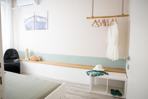 a room with a white bed and a window at Il Confine Azzurro in Porto SantʼElpidio