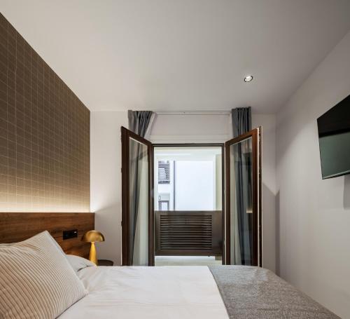 Кровать или кровати в номере Apartamentos Turísticos de Soria 36 Collado