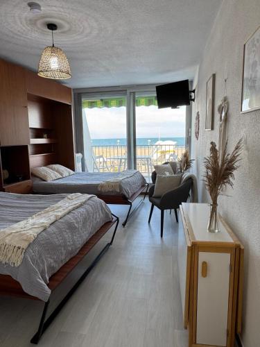 Кровать или кровати в номере La Rose des Sables Vue à 180 degrés sur la Mer