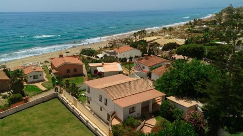 Beachfront with Private Terrace, Garden, BBQ, and Garage in Marbella