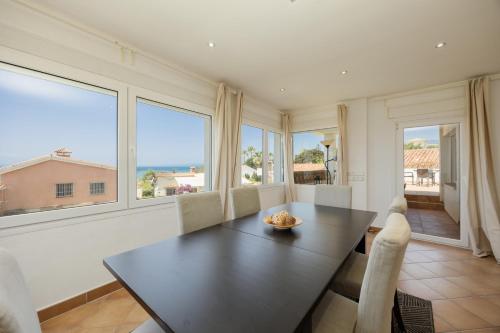 Beachfront with Private Terrace, Garden, BBQ, and Garage in Marbella