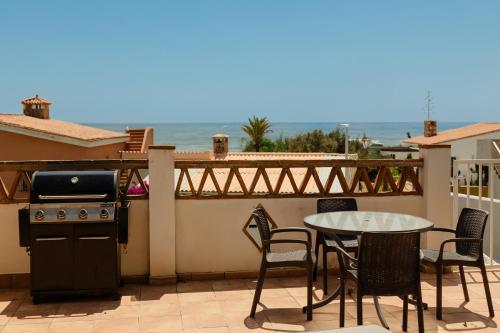 Beachfront with Private Terrace, Garden, BBQ, and Garage in Marbella