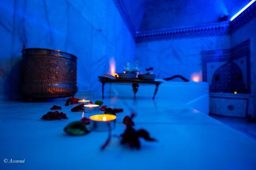 a room with a table and some figurines on the floor at Riad Alia Suites SPA in Chefchaouene