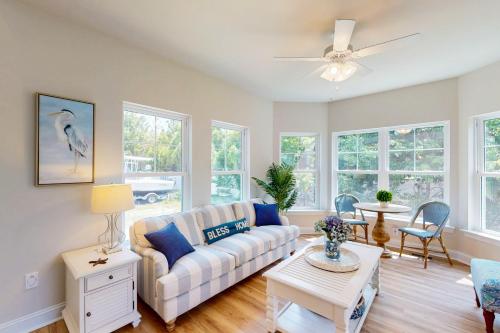 a living room with a couch and a table at Bay Dreams --- 31415 Erie Ave in Ocean View