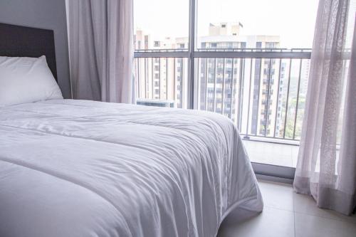 Postel nebo postele na pokoji v ubytování Stay In-Vila Mariana lindo studio a lado do metrô shopping e cafés