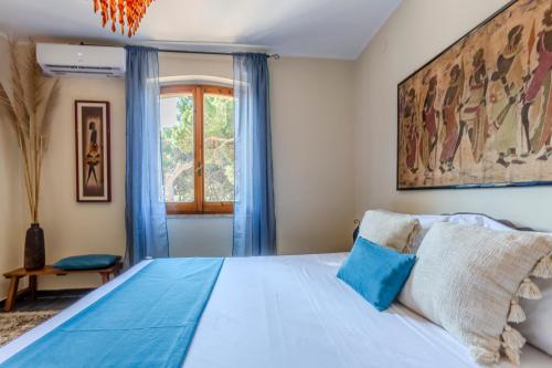 Ένα ή περισσότερα κρεβάτια σε δωμάτιο στο Villa Etnic Eloise