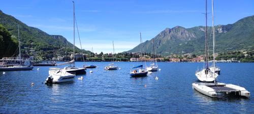 a group of boats sitting in a body of water at Casa Lisander in Lecco