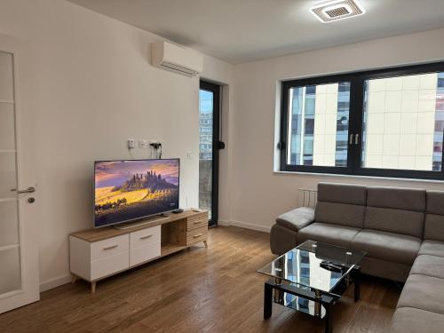 Télévision ou salle de divertissement dans l'établissement Divna