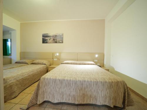 Postel nebo postele na pokoji v ubytování Hotel MARINELLA parking wi-fi spiaggia attrezzata