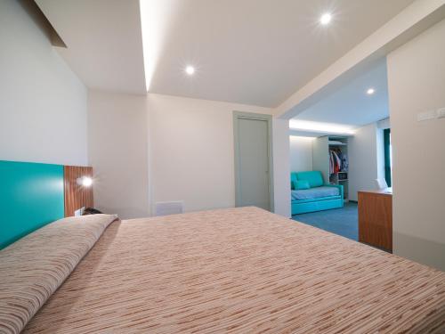 Postel nebo postele na pokoji v ubytování Hotel MARINELLA parking wi-fi spiaggia attrezzata