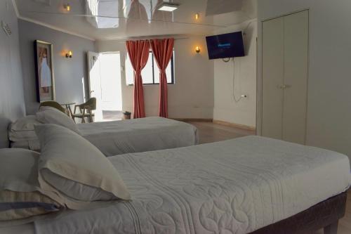 Ένα ή περισσότερα κρεβάτια σε δωμάτιο στο Hotel Flamingo